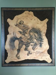 Cowhide artwork with Argentine gaucho on horseback. 